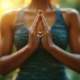 Mindfulness practice with hands in a meditation pose, representing present-moment awareness, self-reflection and holistic wellbeing.